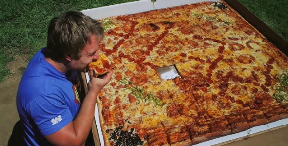 Home Guinness World Record: Peter Czerwinski holding a Guinness World Record certificate for speed eating.