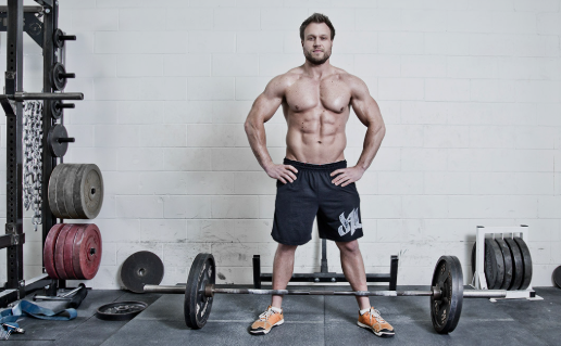 Home Bodybuilding Physique: Fitness guru Furious Pete showing off his muscular physique after an intense gym workout.