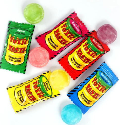 what is the most sour candy in the world Assortment of Toxic Waste Hazardously Sour Candy including Apple, Watermelon, Lemon, Blue Raspberry, and Black Cherry flavors.